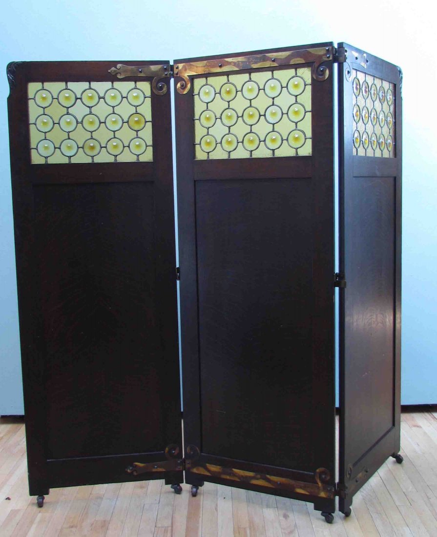 3 panel Arts and Crafts screen w/ stained glass: Title: Arts and Crafts screen, three panel featuring quarter sawn oak and hulls-eye stained glass windows Date: circa 1910 Medium: walnut Dimensions: 67.5 x 72 inches