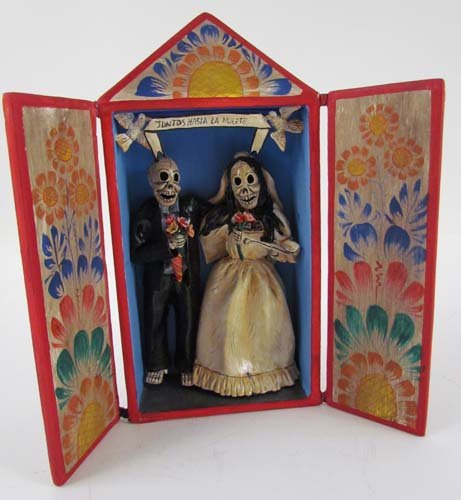 Peruvian Novio Retablo "Juntos Hasta La Muerte": Title: Small Peruvian Retablo with leather hinged doors, Novio Couple inside with Juntos Hasta La Muerte (Till Death Do Us Part) on overhead banner Medium: wood, papier mache' Dimensions: 7.5 x 3.75 x