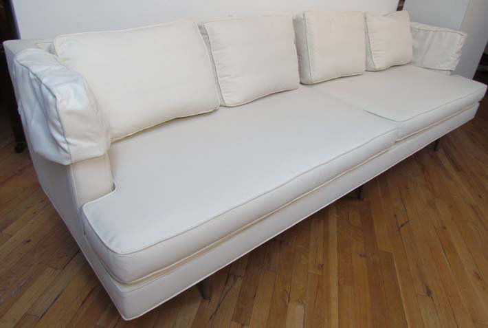 Edward Wormley sofa, model 4907A Long Sofa: Artist: Edward Wormley Title: EDWARD WORMLEY / DUNBAR Four-seat sofa with ivory fabric upholstery, on fluted wooden legs , possibly teak Date: circa 1954 Medium: upholstery and wood Dimensions: 29 x 1