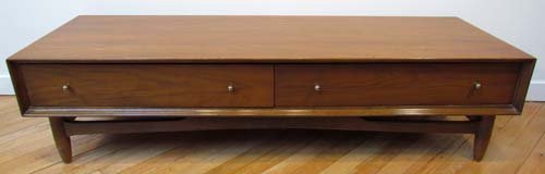 Two drawer walnut veneer low coffee table: Title: 2 drawer coffee table Medium: wood, metal pulls Dimensions: 13.75 x 54 x 18 inches