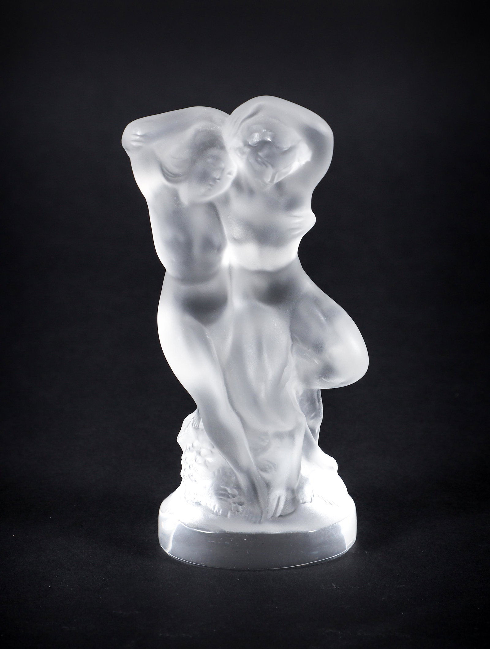 Lalique France Frosted Crystal Le Faune Figure : A Lalique frosted crystal figure, Le Faune, French, designed by Marc Lalique in 1960, depicting a faun and nymph embracing, incised Lalique France at underside. 5.5 x 2.25 x 2 inches.
