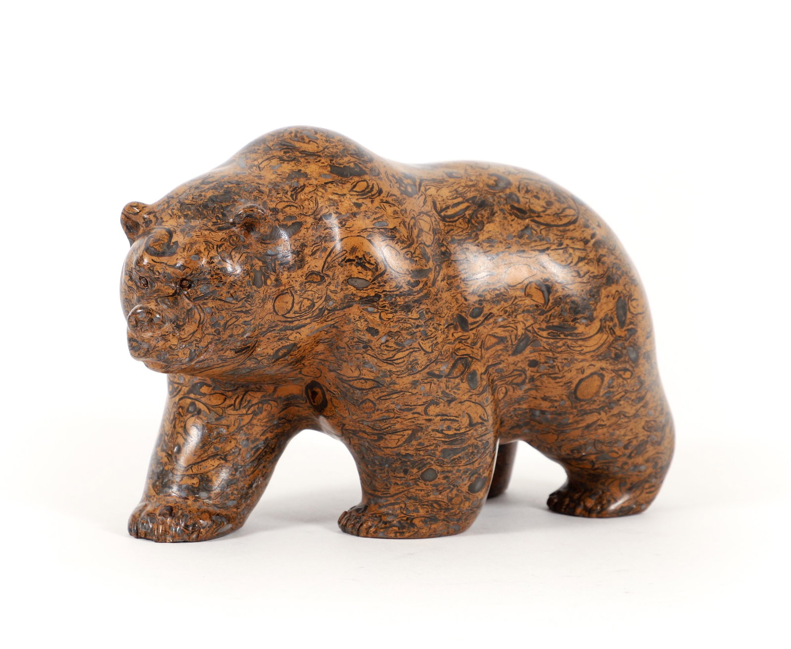 Ken Q Li carved fossilized stone Bear: Li, Ken Q (Chinese/Canadian, born 1958), Bear, 2009, fossilized stone, 4.5 x 7 x 3.5 inches, with attached paper label on underside.