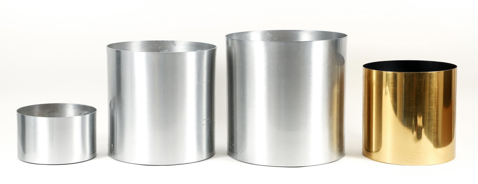 Group of 4 Brushed Aluminum Planters : Group of 4 planters, 3 brushed aluminum, 1 gold tone metal. All apparently unmarked. 6.5 x 10 to 16 x 16 inches.