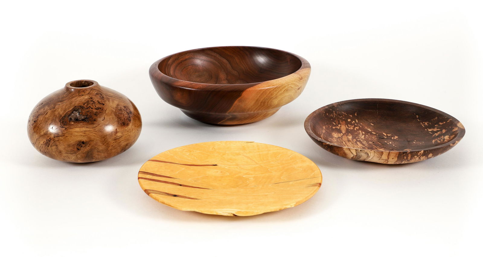 Group of 4 Contemporary Turned Wood Pieces: A group of 4 contemporary turned wood pieces including: Fred Wilson hollow form turned burl wood vase of black heart sassafras, contemporary, signed and marked Black Heart Sassafras at underside, 3.75