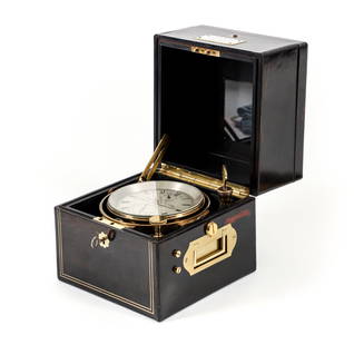 Bryer and Son London 19th Century Marine Chronometer: A Bryer and Son two-day marine chronometer in an ebony wood three-part case with brass inlays, gryphon in shield inlay at top surface, upper button release, lock with key to lower portion fitted with