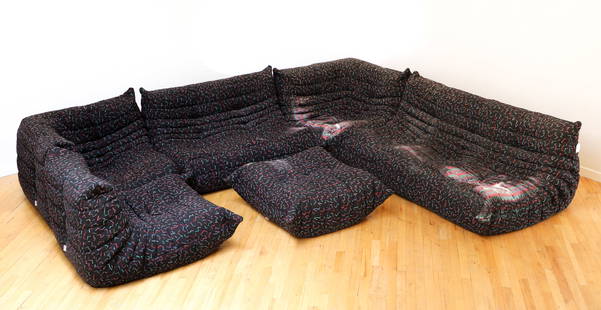 6 Section Michel Ducaroy for Ligne Roset Togo Sofa: A Michel Ducaroy for Ligne Roset 6 section "Togo" sofa, French, 1990s. In Memphis Noir upholstery featuring geometric shapes of pink, purple, green, and teal on black ground. Fabric Ligne Roset tags a
