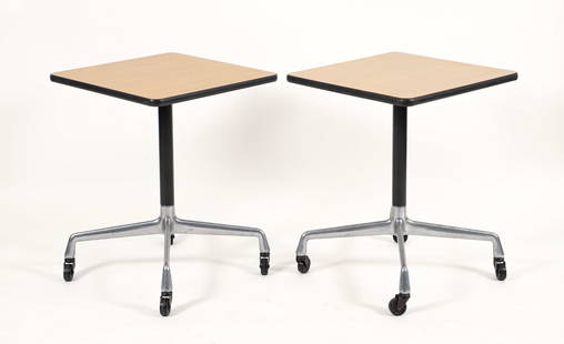 Pr Eames for Herman Miller Aluminum Group Task Tables: A pair of Charles and Ray Eames for Herman Miller Aluminum Group task tables on castors. Square laminate photo finish wood grain table tops over metal and aluminum x form pedestal bases. Paper Herman