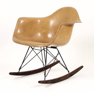 Eames for Herman Miller RAR Rocking Chair: Charles and Ray Eames for Herman Miller RAR rocking chair, molded fiberglass in light ochre, black oxide base. Unmarked. 26.5 x 24.5 x 27 inches.