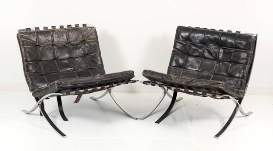Pr Mies Van Der Rohe Barcelona Chairs in Black Leather: A pair of Ludwig Mies Van Der Rohe for Knoll Barcelona chairs with original black leather tufted upholstery and straps, chrome frames. 29.25 x 29.25 x 30.25 inches.