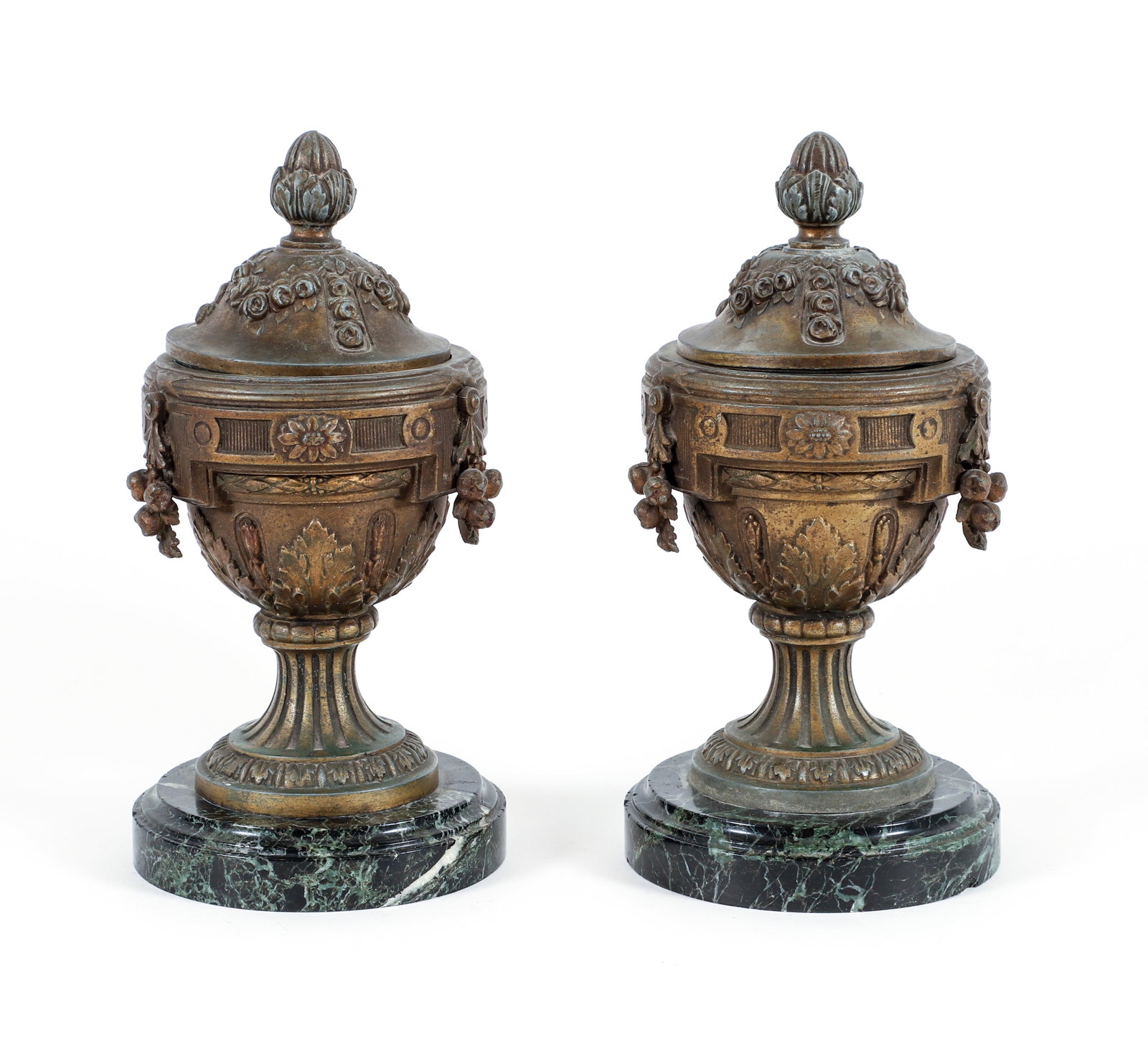 Pair of lidded classical metal urns on marble bases: Lidded Metal Urns with hanging garlands of flowers and classical decoration on green marble bases, 11.75 inches tall