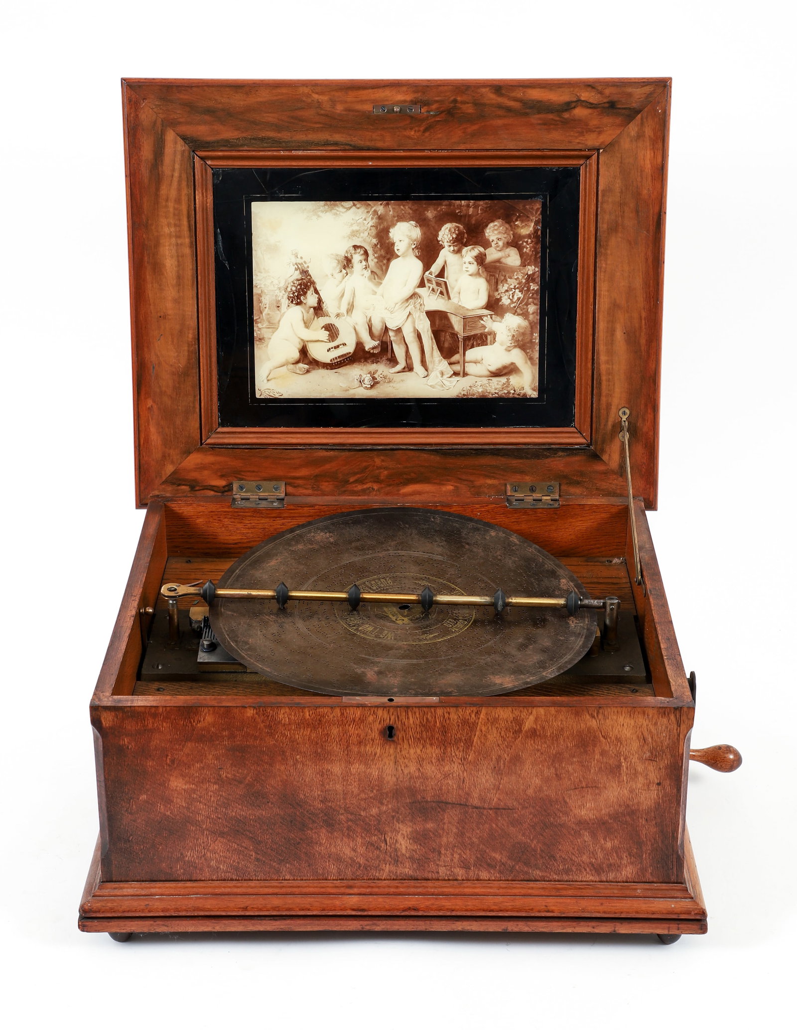 Schutz-Marke Symphonion Music Box: Schutz-Marke Symphonion music box, serial #230471, German, late 19th century. Crank operation with a double-comb mechanism and brass rolling arm. All housed in a walnut box case raised on bun feet, li