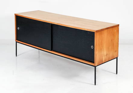 Paul McCobb For Winchendon Planner Group Credenza: Paul McCobb For Winchendon Planner Group credenza on frame. Natural maple casing with textured black textile covered sliding doors, which open to reveal one shelf at each side. Black enameled steel ba