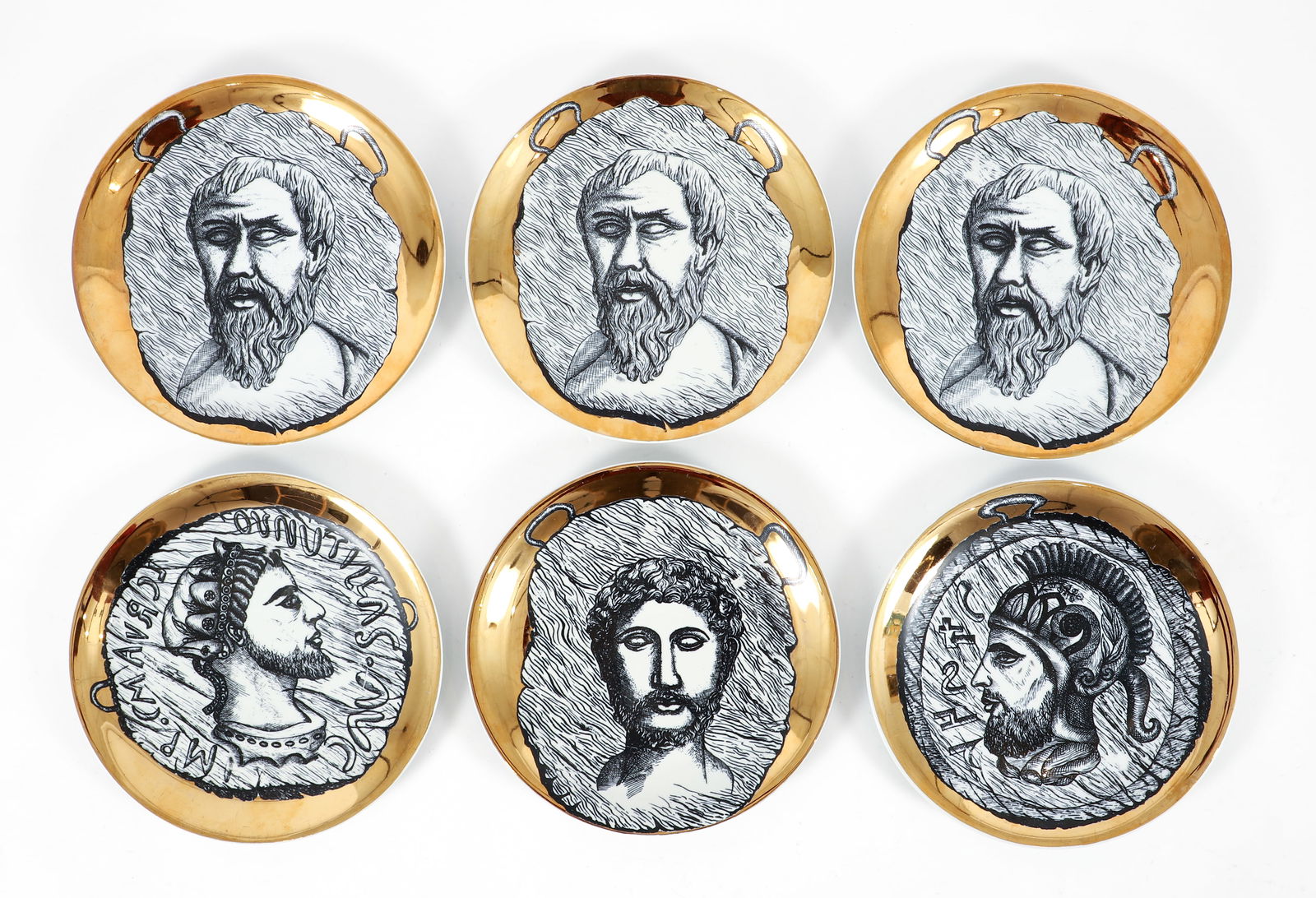 6 Fornasetti style gilded plates by Bucciarelli: Six Italian Mid-Century Modern gold painted porcelain plates in the style of Piero Fornasetti. Bucciarelli was a Milano based porcelain company. Each with Bucciarelli on the reverse, 10.5 inches in di