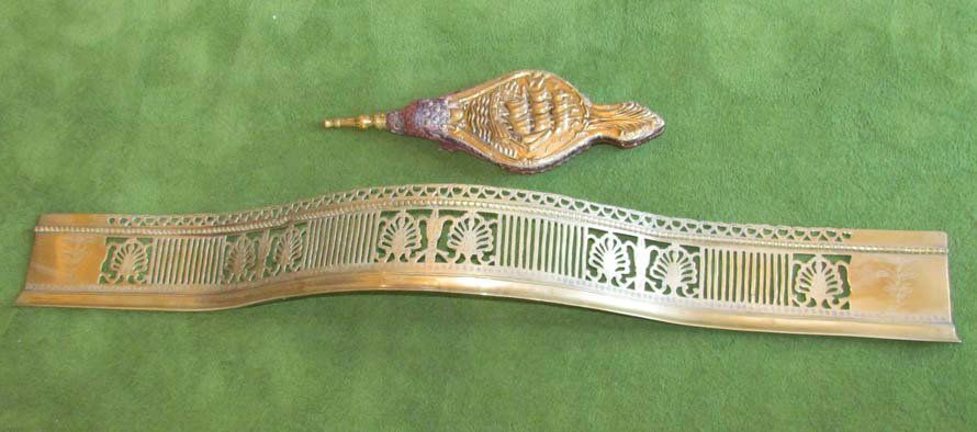 Serpentine Pierced Brass Fireplace Fender & Bellow: Title: Serpentine Pierced Brass Fireplace Fender with unusual highlights engraved on the fans, along with an embossed brass bellows with wood substrate and sound leather Date: ca 1900 Medium: brass, w