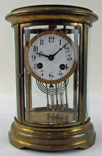 Brass and Crystal Shelf Clock: Title: Brass and Crystal Shelf Clock w/mercury pendulum Medium: crystal, brass Dimensions: 9 x 6.5 x 5.75 inches Provenance: Dr. Bernard and Ruth Grossman