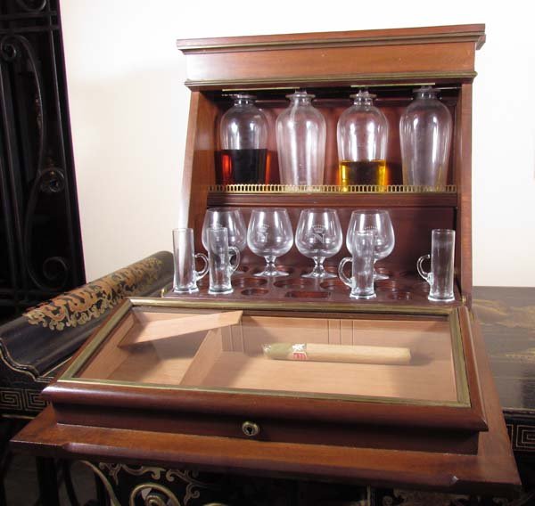 John Barrymore's personal Humidor/Bar: Artist: Barker's Patent Lubar, Albert Barker, New Bond Street, London Title: John Barrymore's Personal Mahogany and Brass inlaid fall front Tantalus/Humidor, with inlaid monogram, interior fitted with