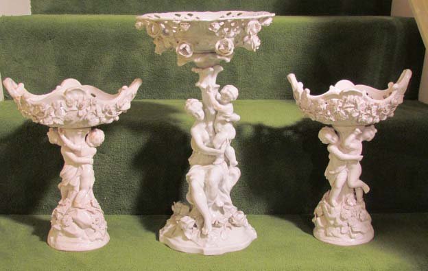 3 pcs Old Paris Porcelain Table Garniture: Title: 3 Pieces of old Paris white Porcelain Garniture with center piece in cobalt blue under glaze and a double conjoined "R" Medium: porcelain Dimensions: side pieces:11 inches, center piece 15 inch