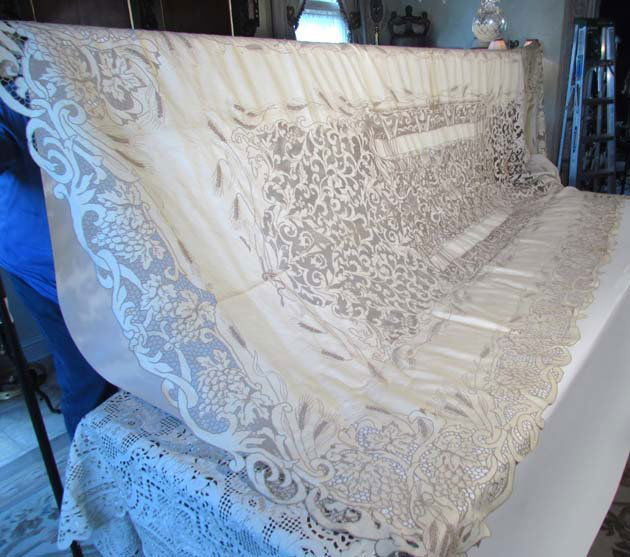 Highly Elaborate Last Supper Ital. Lace Tablecloth: Title: Italian Lace & Linen Tablecloth & 13 Napkins depicting the Last Supper with Embroidered Apostle Names, grape and wheat decoration Medium: lace and linen Dimensions: 11 feet 4 inches long x 64 i