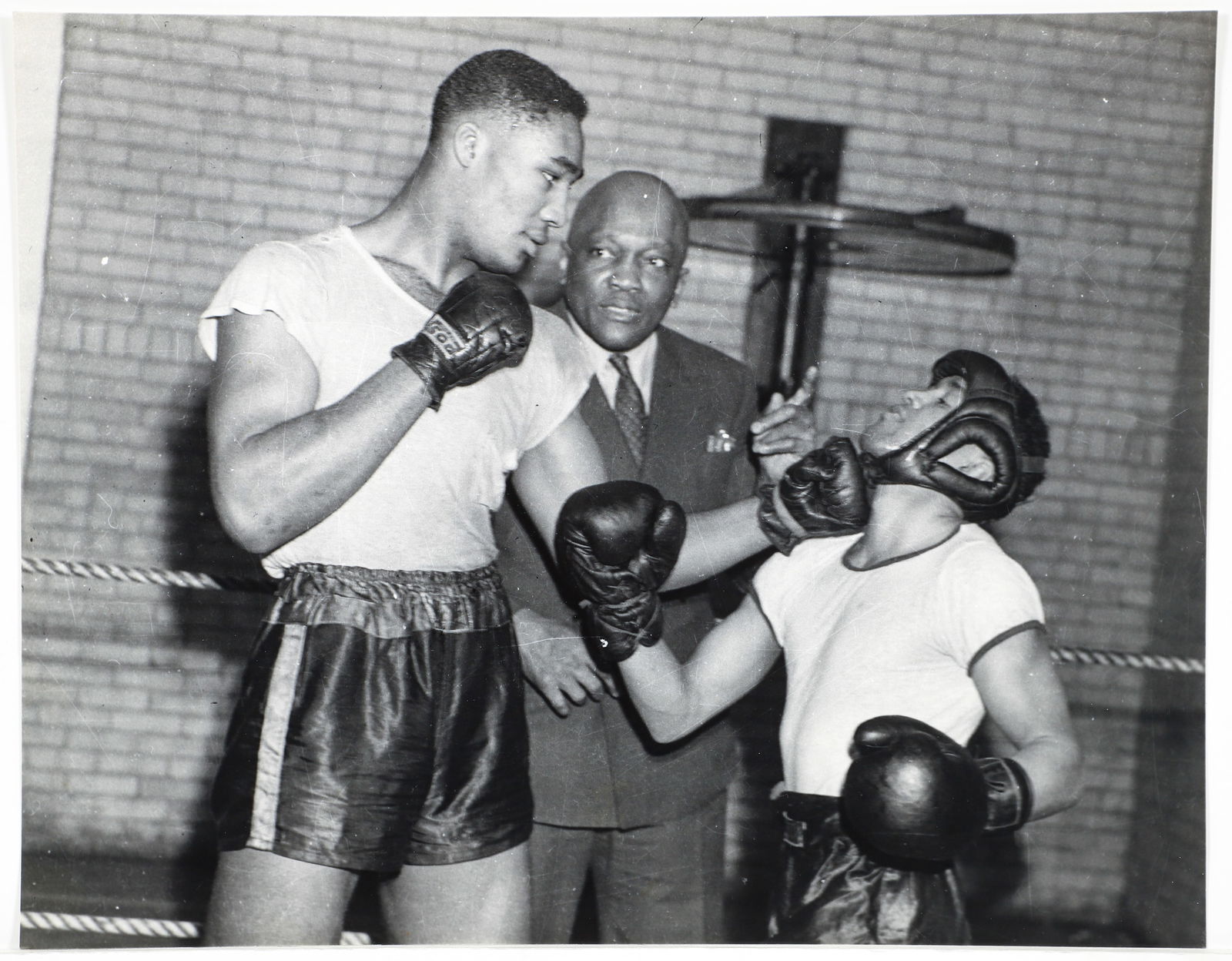 Charles Teenie Harris Photograph Jack Johnson and Boxer: Harris, Charles (Teenie) (American/Pittsburgh, 1908-1998), Heavyweight boxing champion Jack Johnson, coaching heavyweight boxer Harry Bobo punching another fighter in ring, Centre Avenue YMCA, taken F
