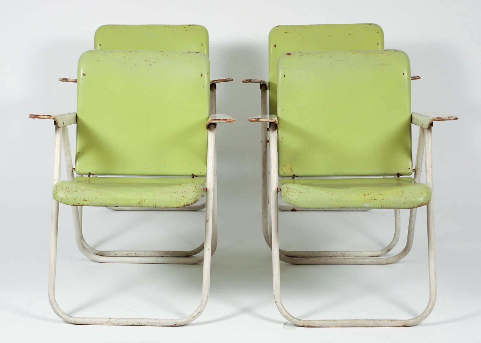 Set of 4 Russel Wright for Samson Chairs: A set of 4 Russel Wright for Samson Chairs, American, 1950s. Folding arm chairs in original spring green and white finish. Samson Chairs paper labels on undersides. 31 x 26 x 29 inches. Russel Wright