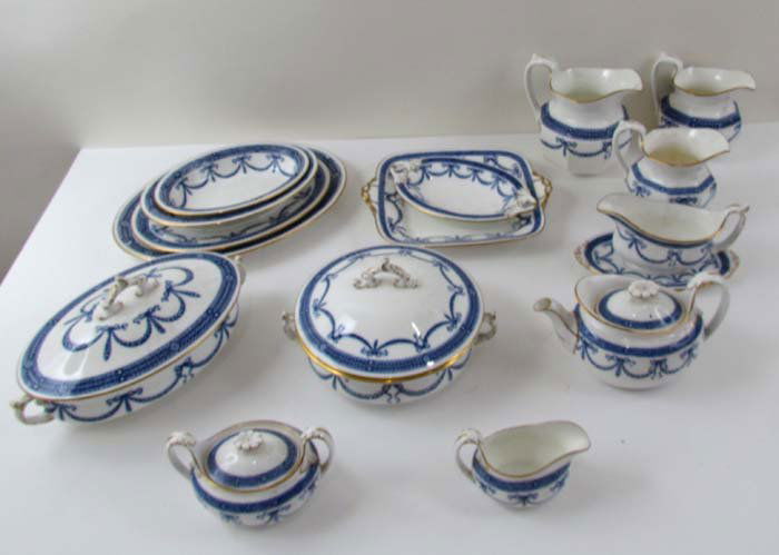 A Large Set of Blue & Gild-Edged Antique Wedgwood: Artist: Wedgwood Title: Large Set of Blue and Gild-Edged Antique Wedgwood China, pattern x7492 or x4692, including 10 various serving dishes, some with covers, 3 Pitchers, Creamer & Sugar, Lidded Teap