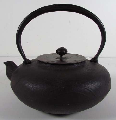 Japanese iron tea Kettle 19th Century: Title: Iron Tea Kettle, the kettle has a casting sprue mark on the underside Date: 19th Century Medium: iron teapot Dimensions: 7 x 7.5 x 7 inches