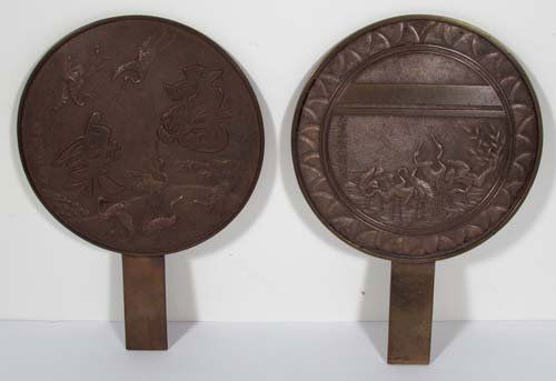 2 Japanese Bronze Mirrors: Artist: Japanese Bronze Craftsman Title: Bronze Mirrors, with Cranes in low relief, one with Japanese Characters Medium: cast bronze Dimensions: 12.25 inches tall Provenance: Nancy Recht Collection<