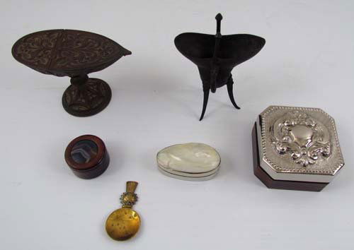 Assortment of Decorative Objects: Title: Assortment of Small Decorative Items: Wood box with Silver Ram's Head Designed lid, Iron Footed Vessel, Brass Scottish spoon Rest, Brass Footed Boat, Small Wood box & Lidded Abalone Shell Box M