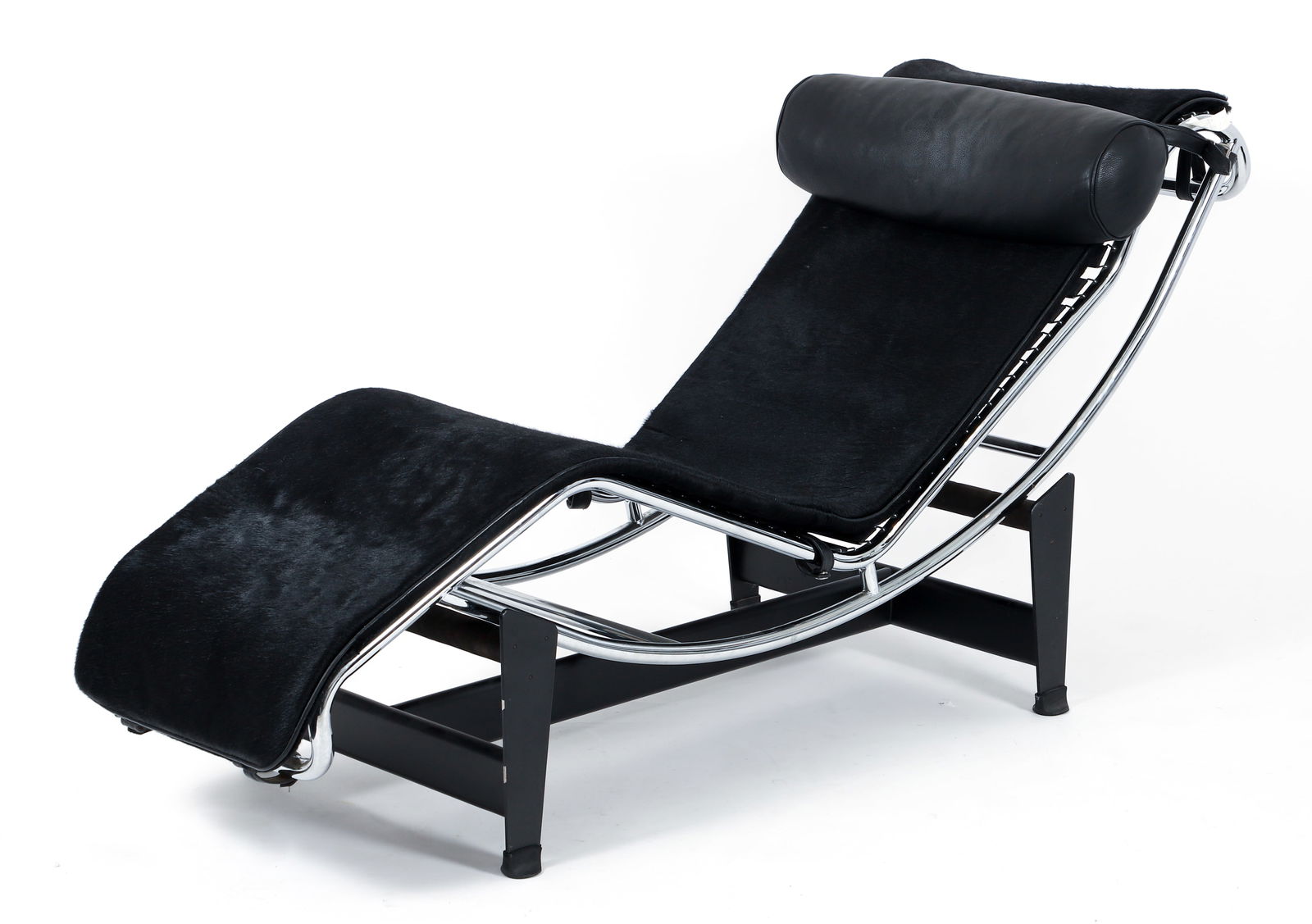 Le Corbusier LC4 style Cowhide Chaise Lounge Chair: Le Corbusier LC4 style Cowhide Chaise Lounge Chair, c.1990s, unmarked, black haired hide upholstery, pillow with leather straps, steel base and rubber feet, 27.5 x 63 x 18 inches. A modern production