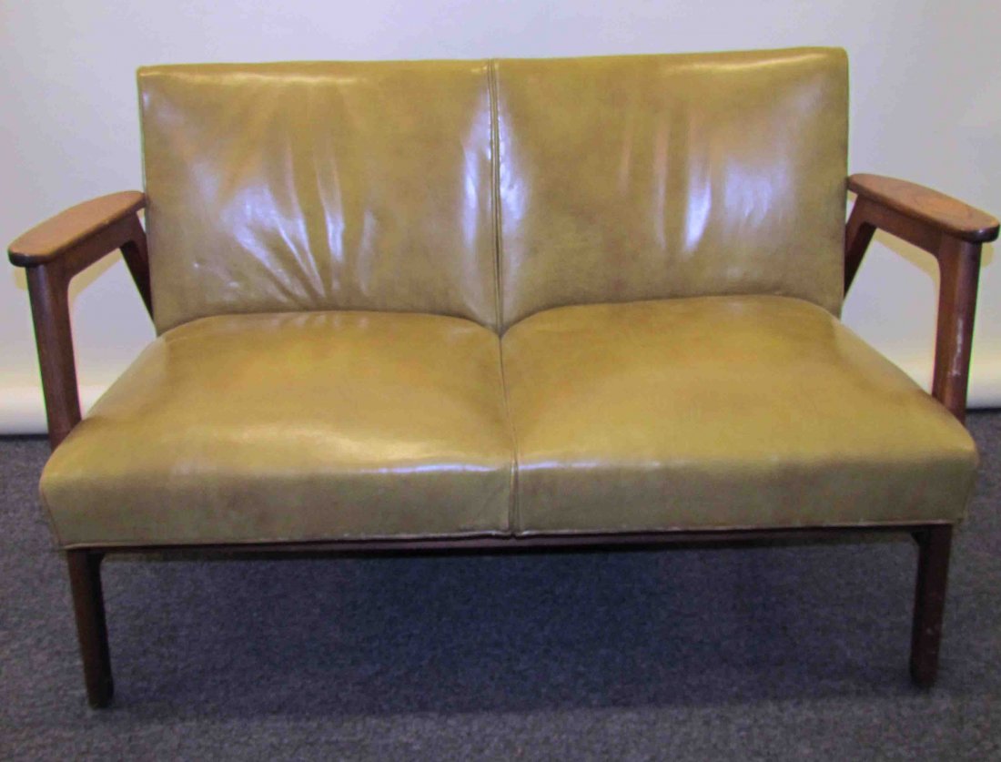 Attrib. Norman Cherner for Gunlocke 2 Seater Sofa: Artist: Cherner, Norman, Attrib. Title: 2 Seater Sofa Date: c. 1960 Medium: American walnut, vinyl upholstery Dimensions: 29.5 x 47 x 25 inches Signature: label on underside Provenance: <