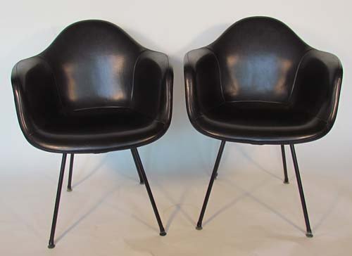 Set of 2 Eames DAX Chairs with Naugahyde Covers: Artist: Eames, Charles and Ray for Herman Miller Title: Set of 2 Eames DAX Chairs with Black Naugahyde Covers Date: c. 1950s Medium: fiberglass, naugahyde Dimensions: 35.75 x 25.5 x 24 inches Signa