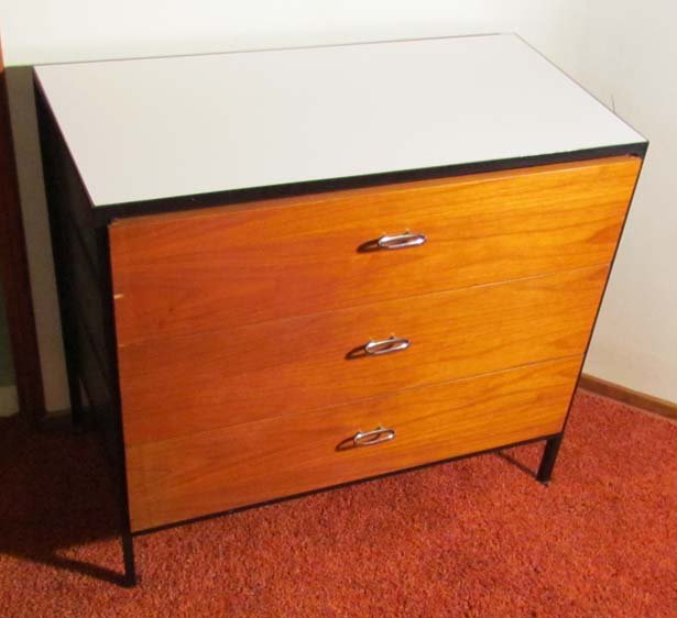 Nelson Herman Miller Steelframe Dresser: Artist: Nelson, George for Herman Miller Title: Steelframe Chest with 3 drawers, polished chrome pulls, white top, walnut sides and drawer fronts Date: c. 1950s Medium: walnut with laminate top Dimens