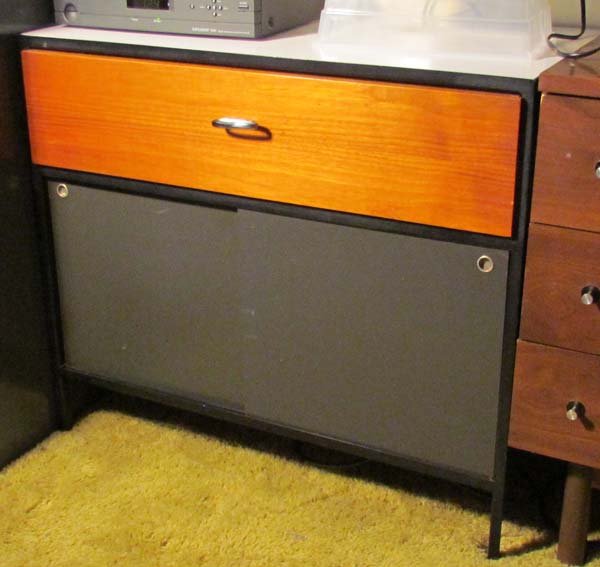 Nelson Herman Miller Steelframe Cabinet: Artist: Nelson, George for Herman Miller Title: Steelframe Cabinet with 1 drawer and sliding doors, polished chrome pulls, walnut drawer and sides Date: c. 1950s Medium: walnut with laminate top Dimen