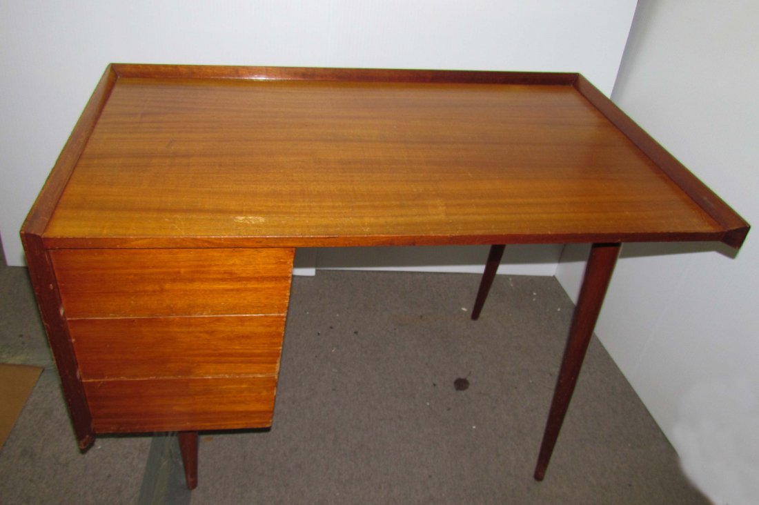 Jens Risom Early Walnut Writing Desk with Gallery: Artist: Risom, Jens (Danish/American Born 1916) Title: Very Early Walnut Writing Desk with rectangular gallery top over bank of three drawers on cylindrical tapering legs, with old red paper label Dat