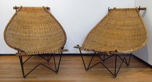 Pr. Mid-century modern rattan lounge chairs: Artist: Tempestini, After Maurizio (Italian, 1908-1960) or Olav Hammerstrom Title: Mid-century modern rattan lounge chairs Medium: Rattan with steel base Dimensions: 38 x 36 x 37 inches Provenance: Dr