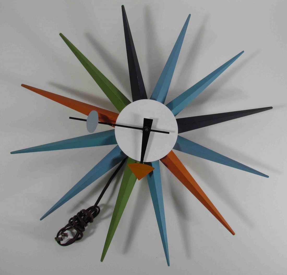 George Nelson & Associates Spike wall clock: Artist: Nelson, George & Associates Title: Spike wall clock, model #2202 Date: c. 1952 Medium: lacquered and painted wood, enameled aluminum Dimensions: 19 x 19 x 2.5 inches Edition: Howard Mi