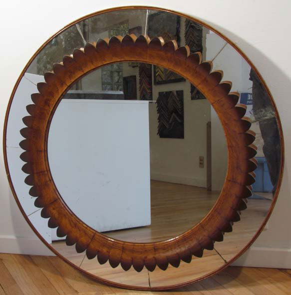 Line Vautrin style round Mirror w Walnut Sunflower: Title: Line Vautrin Style Art Moderne round mirror, with carved walnut petals around as a sunflower Date: French before 1950 Medium: walnut, mirror Dimensions: 36 inches diameter Description: Manufact
