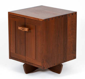 George Nakashima Kornblut Cabinet: Nakashima, George (Japanese/American, 1905-1990), Kornblut Cabinet/Nightstand, mid 20th century, figured walnut, cherry, dovetail joints, and free edge burl wood pull. 22 x 20 x 18 inches. Provenance: