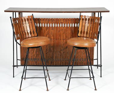 Arthur Umanoff Mid Century Iron and Walnut Bar with Stools: Umanoff, Arthur (American, 1923-1985), Dry bar in iron and walnut, formica top, one shelf, along with two matching vinyl topped stools, 59.5 wide x 17.5 deep x 40.5 inches high (bar); 37.5 inches tall