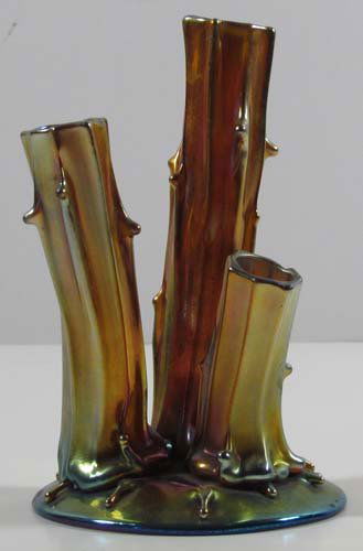 Steuben Gold Aurene glass tree stump bud vase: Title: STEUBEN Gold Aurene tree stump bud vase Date: circa 1910 Medium: Steuben Gold Aurene glass Dimensions: 6 x 4 x 3.75 inches Signature: Etched Steuben Aurene 2744 Provenance: Tish Cor