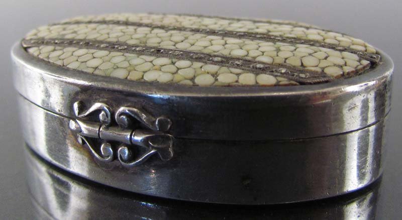 Silver, Sharkskin and Hematite Compact: Title: Silver, Sharkskin and Hematite Compact Date: early 20th century Medium: silver, sharkskin, hematite Dimensions: 1.5 x 2 x .5 inches Description: beautiful compact with striped lid of sharkskin