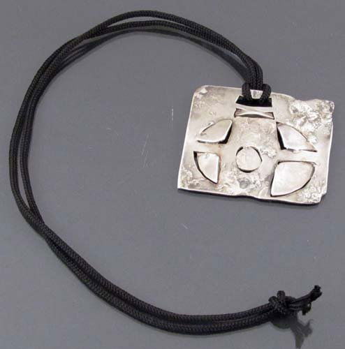 Tish Corbett Handmade Rectangular Silver Pendant: Artist: Corbett, Tish (American, b ca 1922) Title: Handmade silver rectangular pendant with triangular cuts and casting detail by Tish Corbett Date: ca 1970 Medium: sterling silver Dimensions: 2 x 2.