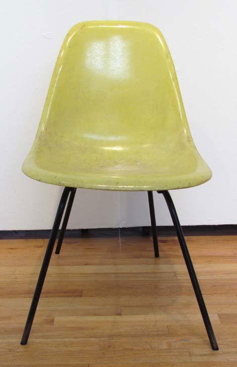 Yellow Eames Fiberglass shell chair: Artist: Eames, Charles and Rae Eames for Herman Miller Title: Charles & Ray Eames for Herman Miller Fiberglass shell chair Date: 1960's Medium: fiberglass & metal Dimensions: 31 x 18.5 x 16 inches