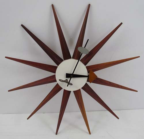 George Nelson Spike clock, Howard Miller Model 2202: Artist: Nelson, George, for Howard Miller Title: Spike Clock, Model 2202 Dimensions: 18.75 x 18.75 x 2.5 inches Description: This model is features the hard to find wind-up movement with original turn