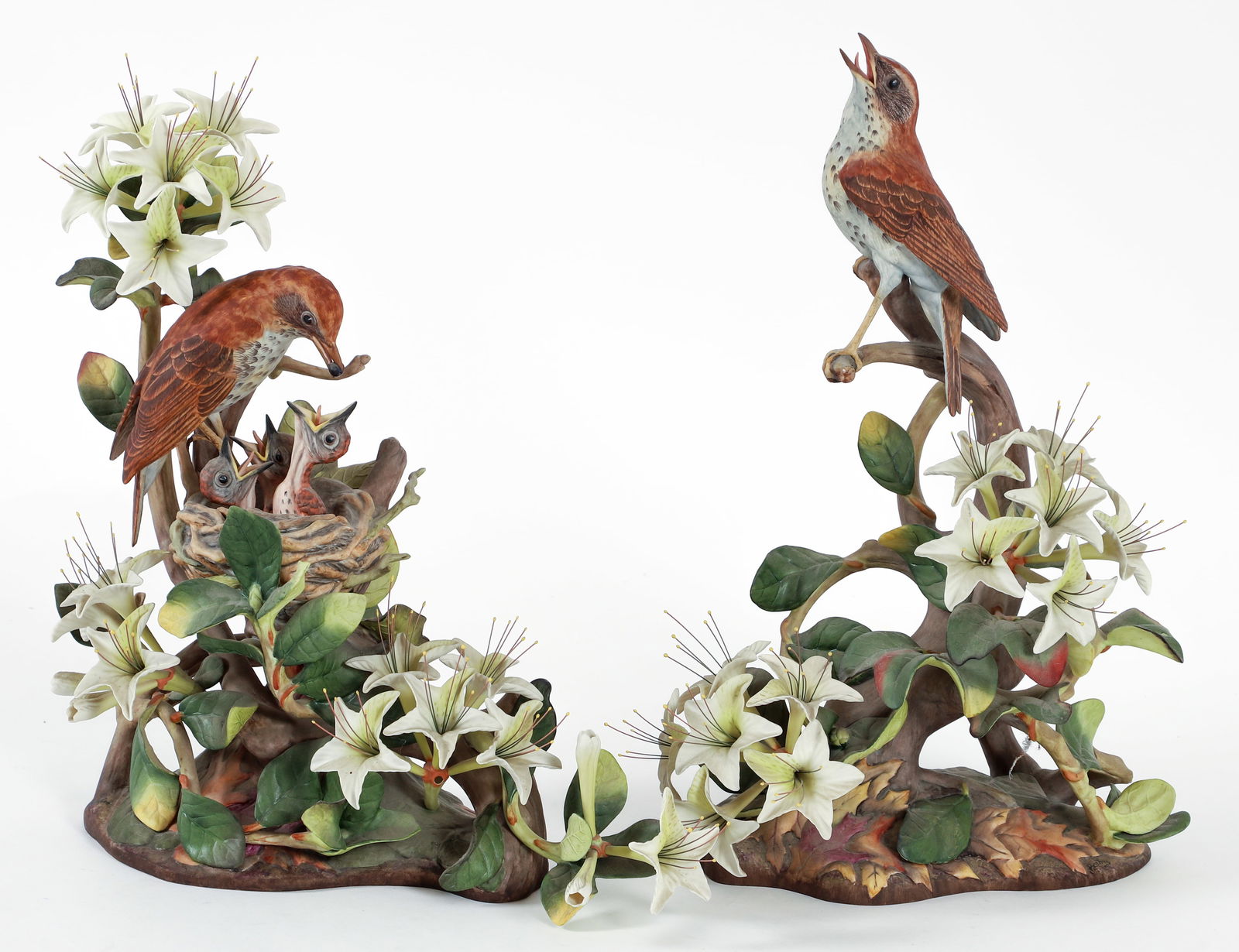 Pair of Boehm Porcelain Wood Thrushes: Pair of Boehm bisque porcelain birds, limited edition Wood Thrushes, male and female, American, introduced in 1966, closed edition By 1975. Signed and appropriately marked on the undersides. Female ap