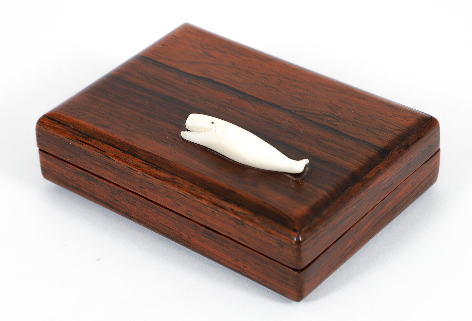 Nancy A. Chase 1974 Rosewood Nantucket Box: Nancy A. Chase 1974 Rosewood Nantucket Box with whale relief on lid, 1.75 x 4 x 3 inches, signed, dated, and inscribed Nantucket Island on box underside.