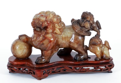 Carved Hardstone Foo Dog trailed by 2 smaller Foo Dogs