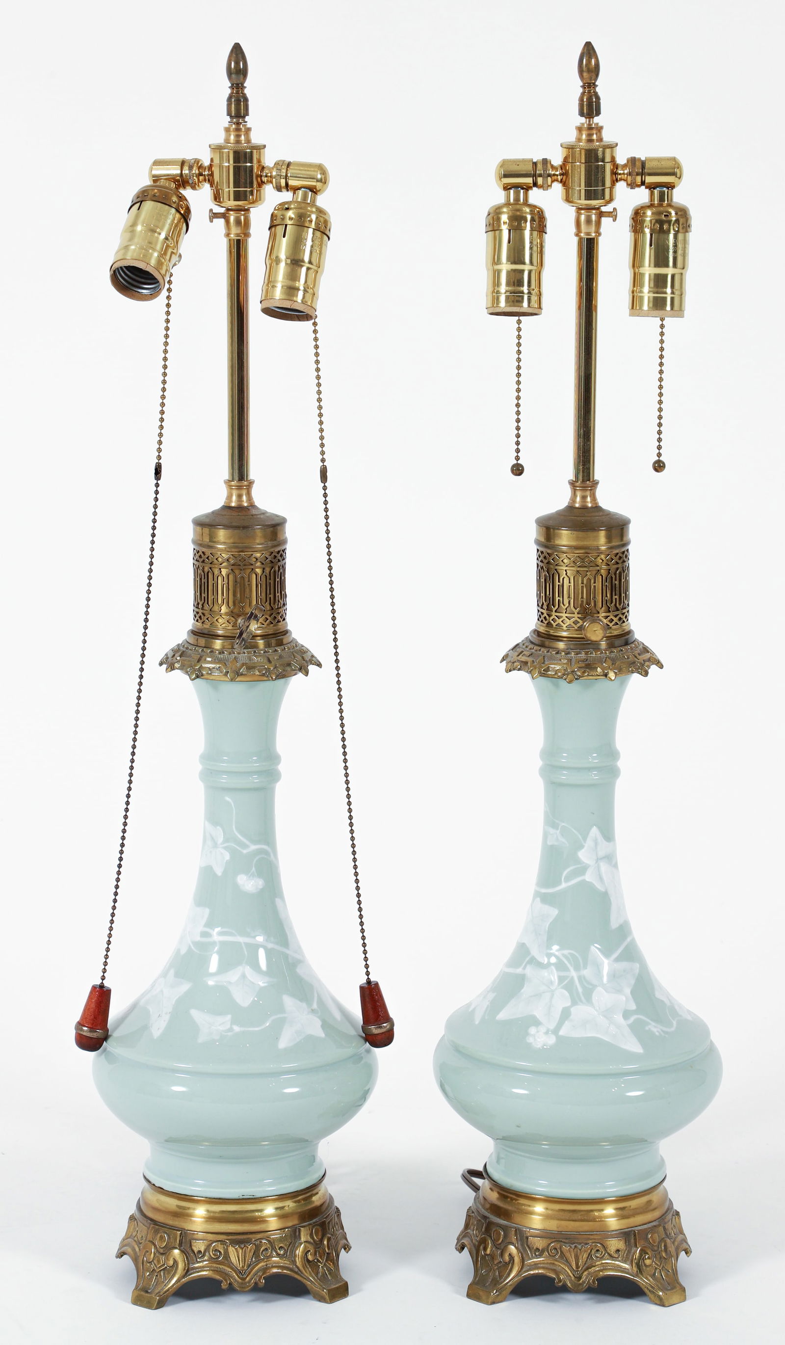 Pair of French Gilt Brass Mounted Pate-Sur-Pate Celadon Vases Fitted as Lamps: Pair of French gilt brass mounted Pate-sur-pate celadon porcelain vases fitted as lamps. With attractive brass fittings. Vases 12 inches tall, lamps 28 inches tall to finial. Provenance: The Estate of