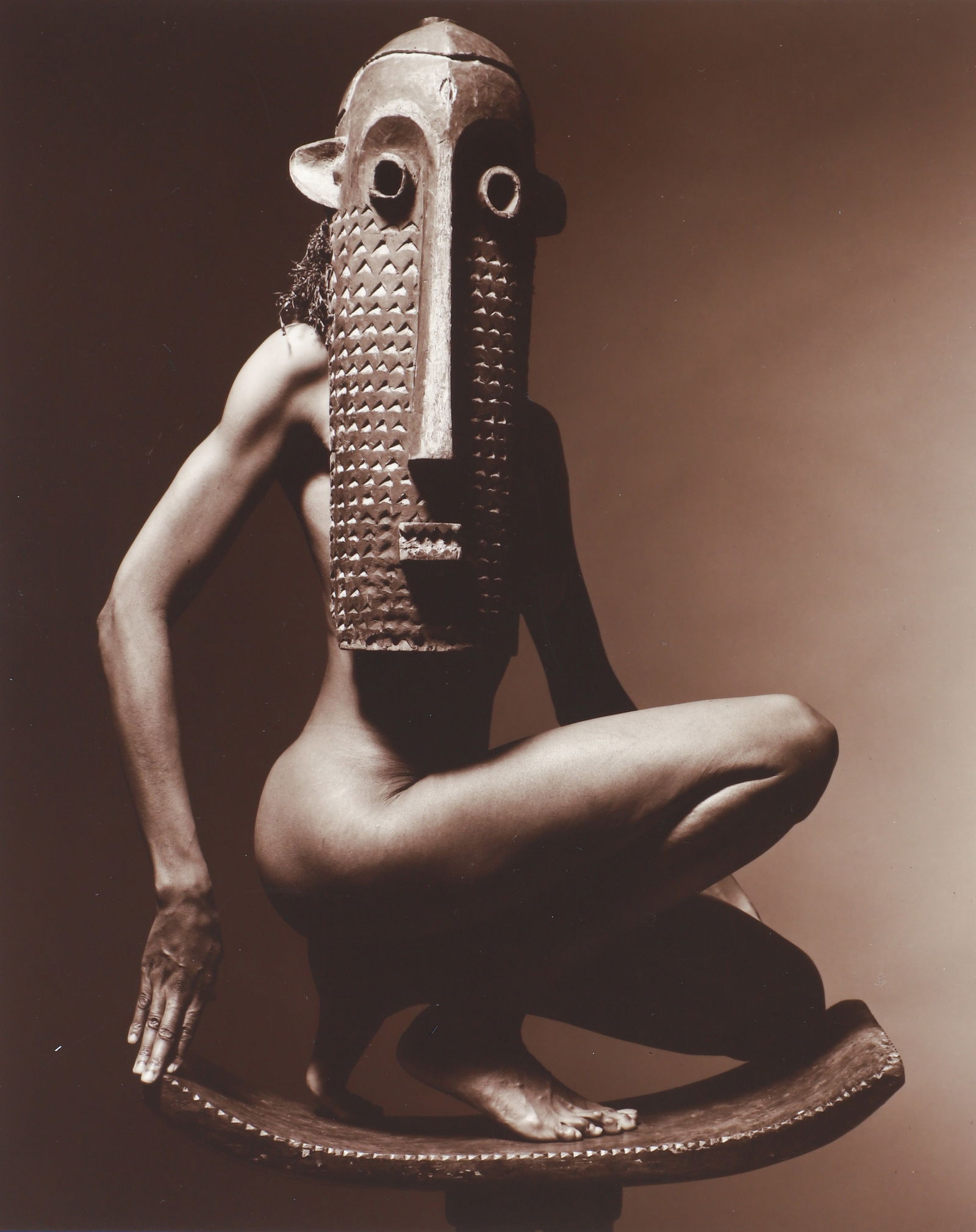 Len Prince 15 photographs with leather portfolio box: Prince, Len (American, born 1953), Leather Bound Portfolio of 15 photographs, featuring nudes wearing African Masks, Nude Studies, Portrait Studies, 15 total, (all in Prince's signature photographic s