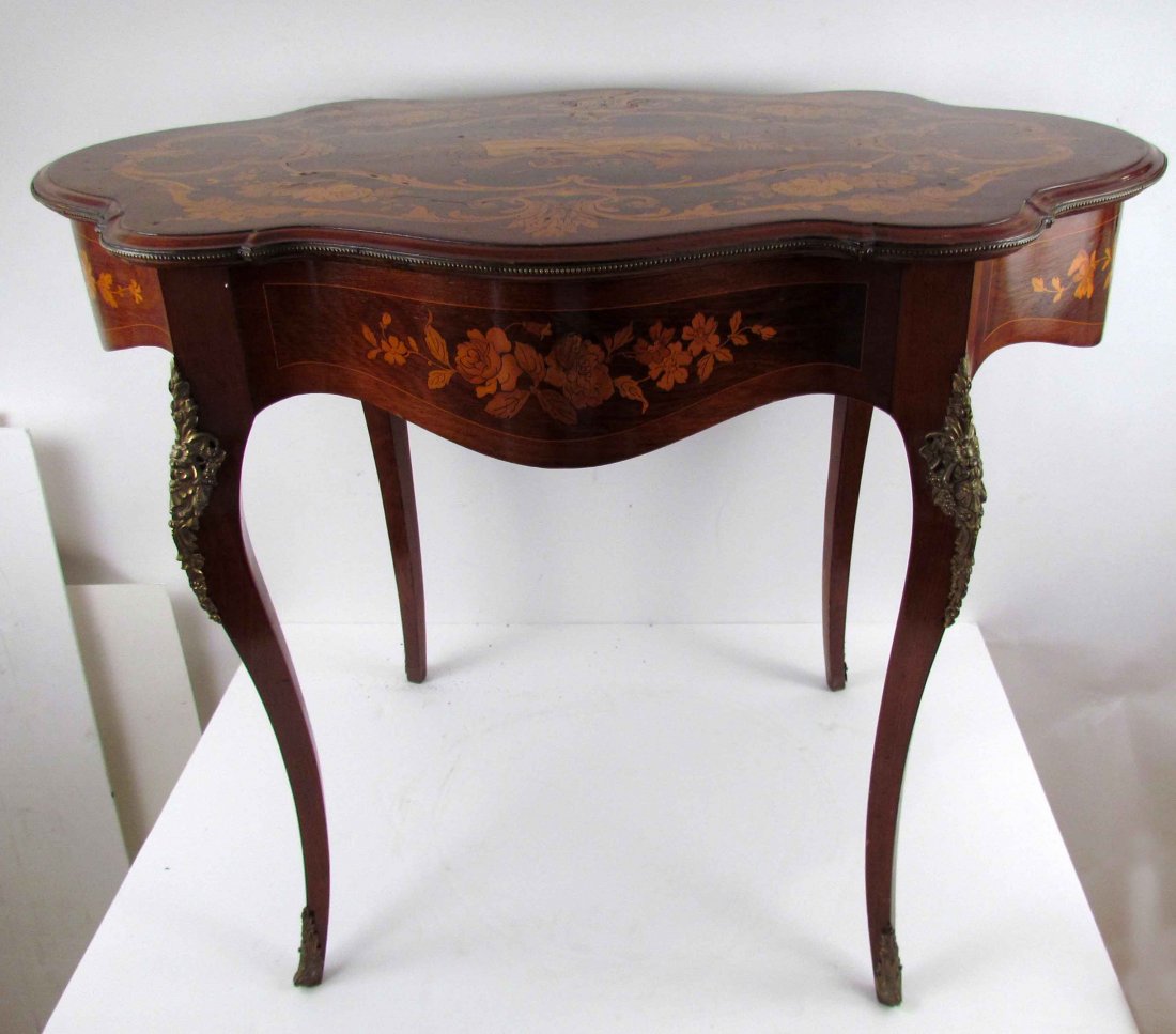 Antique French Mahogany inlaid Turtle Top Table: Title: Antique French Mahogany inlaid Turtle Top Table with ormolu mounting, all over marquetry inlay consisting of musical instruments, flowers and foliate Date: c. 1900 Medium: inlaid wood Dimension